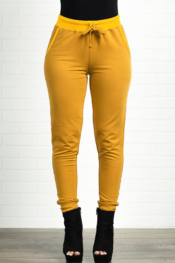 yellow top white pants